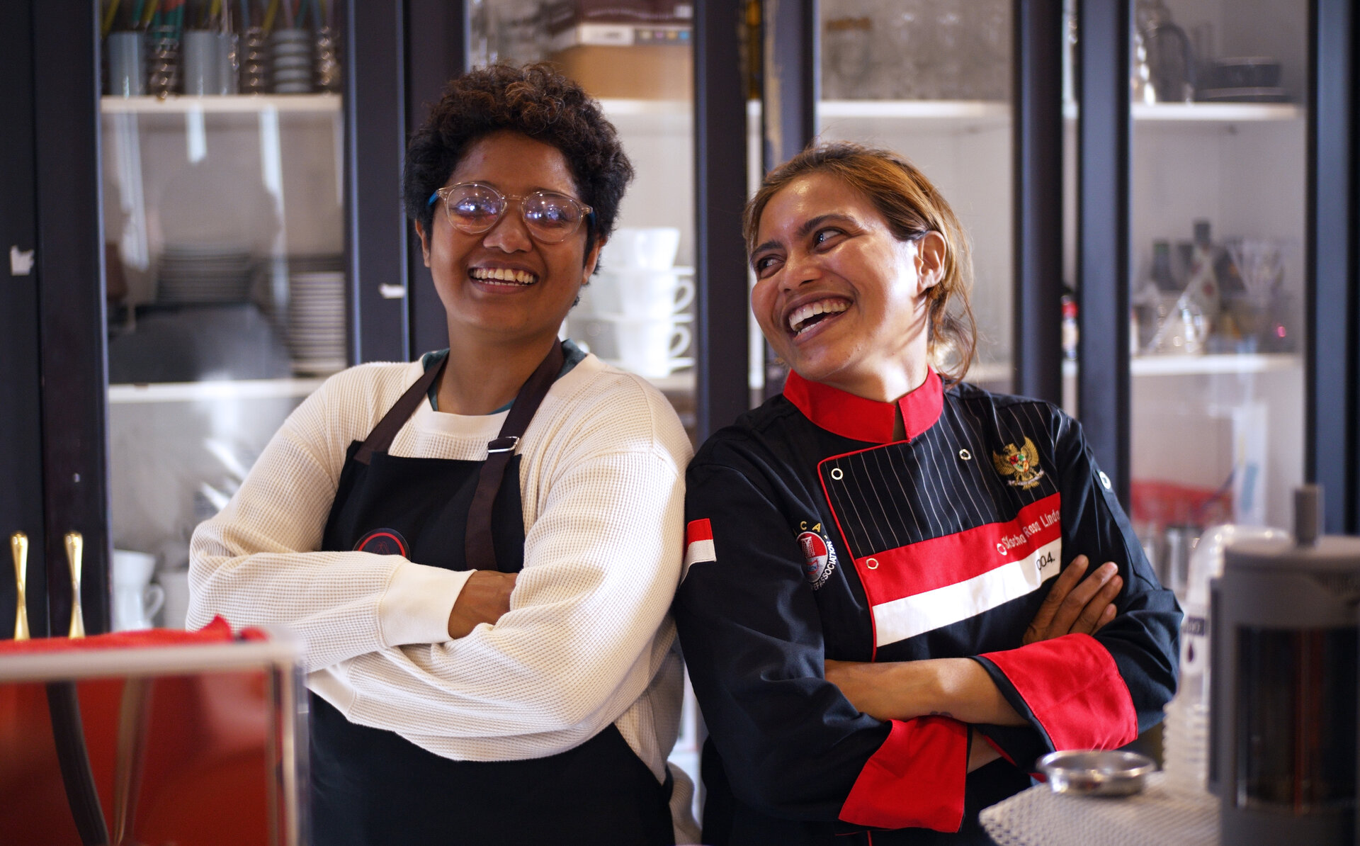 Kopi Saa/Cafe Inklusi co-founders: Kichi Jacob (left) in the CafeIn barista apron and Sischa Solokana in the Indonesian Chef Association uniform.